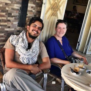 Two scientists enjoying coffee outside a Moroccan cafe