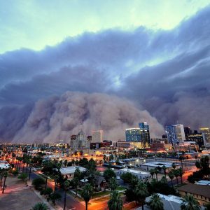 A massive wall of dust rolls over Phoenix at dusk
